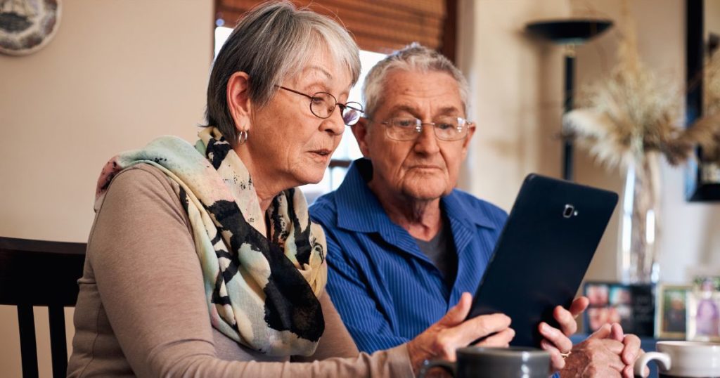 Senior couple looking over information