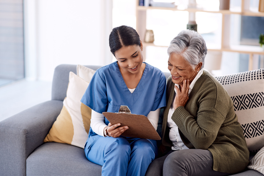 Nurse with a senior women discussing medical insurance